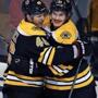11/19/15: Boston, MA: After the Bruins Loui Eriksson (right) beat Wild goalie Devan Dubnyk for the third time, giving him the hat trick, he gets some love from David Krejci (left) . The Boston Bruins hosted the Minnesota Wild in a regular season NHL hockey game at the TD Garden. (Globe Staff Photo/Jim Davis) section:sports topic:Bruins-Wild (1)