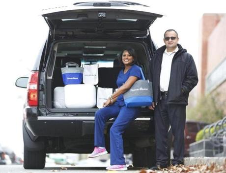 Uber driver Sahin Kaya, of Melrose, drove nurse Shacuiya Lang, of Brockton, around the Boston area so she could administer flu vaccines.
