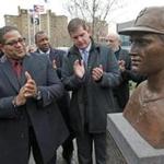 Luis Clemente, (second from left) son of Roberto Clemente, attended the unveiling ceremony in the South End.