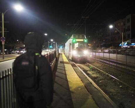 Late-night MBTA riders waited in bitter cold temperatures for a train to arrive earlier this year. Late-night service is losing $14 million a year. 
