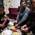 Syrian refugees Mohammad Al Asmi (left), Mahmoud Al Nayef, and Obaida Al Shamali at home in Worcester.