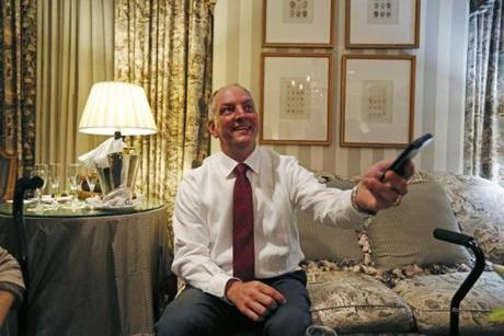 Louisiana Democratic gubernatorial candidate Rep. John Bel Edwards reacted after viewing election returns on an aides phone in a hotel suite at his election night watch party in New Orleans. 
