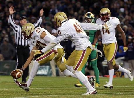 BC defensive back Justin Simmons (left) celebrated a third-quarter pickoff of Notre Dame?s DeShone Kizer in the red zone.
