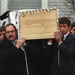More than 1,000 mourners followed the hearse to Sharon Memorial Park on Sunday after the funeral for Ezra Schwartz.