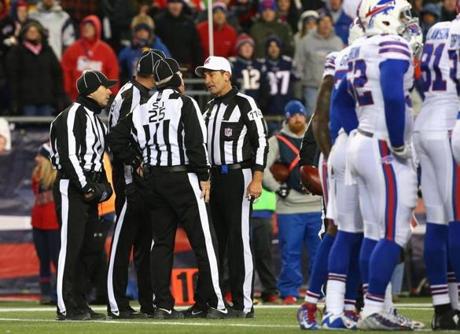 FOXBORO, MA - NOVEMBER 23: Referees gather during the third quarter of a game between the New England Patriots and the Buffalo Bills at Gillette Stadium on November 23, 2015 in Foxboro, Massachusetts. (Photo by Jim Rogash/Getty Images)
