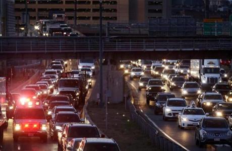 Boston, MA 11/24/2015 â?? An emergency vehicle navigates rush hour traffic on I-93, viewed from Southampton St. in Boston, MA on November 24, 2015. The Tuesday before Thanksgiving is considered the busiest travel day of the year in Boston. (Globe staff photo / Craig F. Walker) section: Business reporter:
