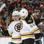Boston Bruins center Frank Vatrano, left, celebrates his goal against the Detroit Red Wings with Dennis Seidenberg (44) in the first period of an NHL hockey game Wednesday, Nov. 25, 2015 in Detroit. (AP Photo/Paul Sancya)