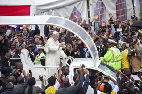 Pope Francis waved to the crowd at the University of Nairobi. 
