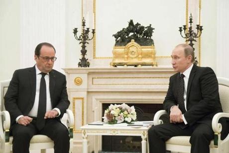 Russian President Vladimir Putin (right) spoke with French President Francois Hollande during a meeting at the Kremlin in Moscow. 
