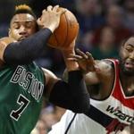 Boston Celtics' Jared Sullinger (7) grabs a rebound away from Washington Wizards' DeJuan Blair during the first quarter of an NBA basketball game in Boston Friday, Nov. 27, 2015. (AP Photo/Winslow Townson)