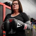 After Catherine Fennelly of Quincy lost her son to an overdose this year, she started a boxing group called Let It Out. 