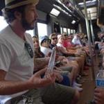 Colorado Cannabis Tours routinely fills its buses. Passengers can choose a cooking class, glassblowing demonstration, or a visit to a cultivation facility (left).