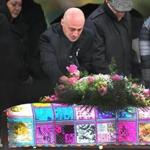 Winthrop-11/28/15- A funeral and burial service was held for Bella Bond, the toddler who became know as Baby Doe after her body was discovered in a trash bag in June on Deer Island in Winthrop. Joseph Amoroso, the child's biological father wept as he took a pink rose from the coffin which was draped in a hand-made quilt with adorned with sayings. Boston Globe staff photo by John Tlumacki(metro)