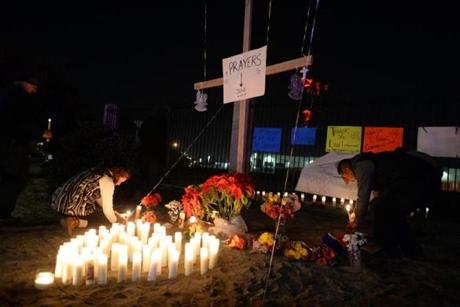 Mourners added to a memorial outside the Inland Regional Center on Thursday, the scene a mass shooting that left 14 dead the day before, in San Bernardino, Calif. 

