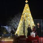 Actress Reese Witherspoon, mother-in-law Marian Robinson, Malia Obama, President Barack Obama and first lady Michelle Obama attended the national Christmas tree lighting ceremony on the Ellipse south of the White House . 