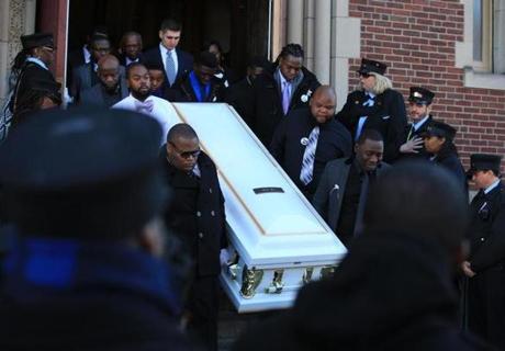 Pallbearers carried Jephthe Chery?s coffin after his funeral at St. Angela Catholic Church. 
