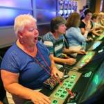 Jean DeThomas of Melrose reacted to a good slot spin after the Plainridge casino opened. Payoffs have since increased.
