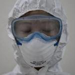 A medical staff member wearing a protective suit waited to enter an isolation ward for patients with Middle East Respiratory Syndrome (MERS) at the Seoul Medical Center. 