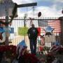 David Santos visited a makeshift memorial for those killed and injured near the Inland Regional Center on Monday.