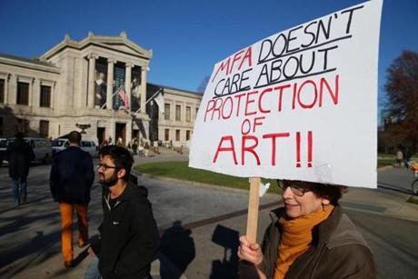 12/05/2015 Boston Ma Maureen Roe (cq) a member of the Museum Independent Security Union protests the treatment of MFA Museum Security Guards where she has worked for 30 years THe guards are seeking better pay and working hours from the museum. Globe/Staff Photographer Jonathan Wiggs
