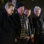 Members of U2 paid homage to Paris attack victims near the Bataclan concert hall on Nov. 14. 