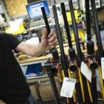 Rifles were stacked before packaging at Smith and Wesson?s Springfield factory. Its stock has more than doubled this year. 
