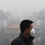 A man wore a mask Tuesday while walking through Beijing.
