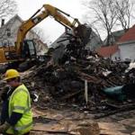 The City of Lynn tore down a building where four people were killed in a fire. 