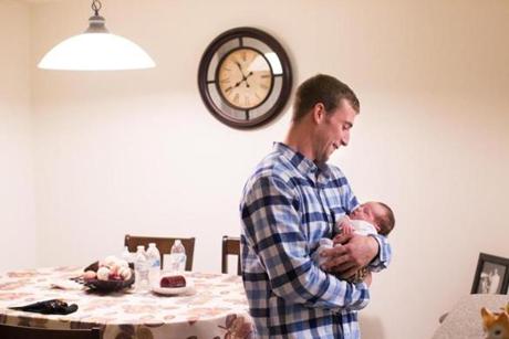 Walpole, MA - 11/30/2015 - Ryan Lonergan holds his daughter Ashtyn in his home in Walpole, MA, November 30, 2015. After serving time in prison for crimes related to his heroin addiction, Lonergan was given the Vivitrol to eliminate his cravings for opioids when he was released. (Keith Bedford/Globe Staff) 

