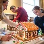 Meredith Whalen and her daughter Paige work on their gingerbread houses.