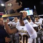 Foxborough, MA - 12/05/15 - (2nd half) Xaverian's Coby Tippett (20) hoists the state championship trophy. D1 Super Bowl: Central Catholic vs. Xaverian. - (Barry Chin/Globe Staff), Section: Sports, Reporter: Bob Holmes, Topic: 06Super Bowls, LOID: 8.2.665237068. 