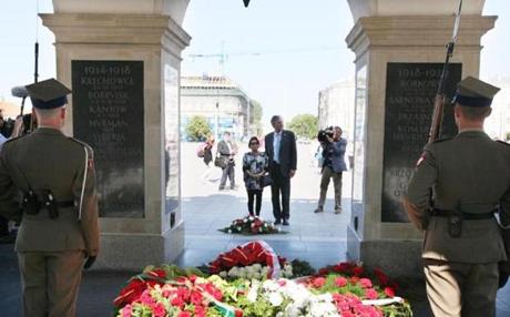 Former Florida governor Jeb Bush (center right) and his wife Columba (center left) laid flowers at the Tomb of the Unknown Soldier in Warsaw, Poland. 
