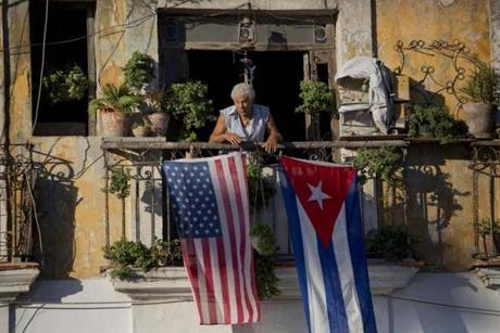 Javier Yanez stood on his balcony decorated with U.S. and Cuban flags in Old Havana, Cuba. 
