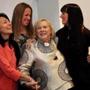 Marcia Roussos is greeted by former students ?the Messina Girls,