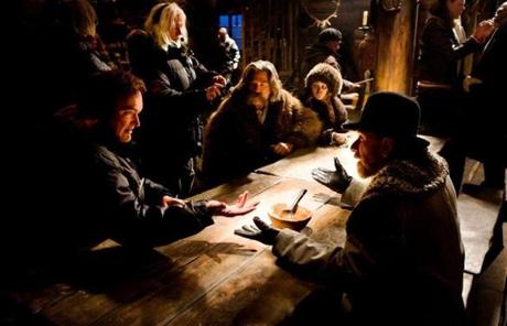 Quentin Tarantino (sitting, far left) directing a scene for his new movie, ?The Hateful Eight.? 
