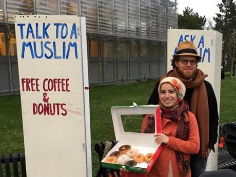 Mona Haydar and her husband, Sebastian Robins, stood outside of a library in Cambridge.
