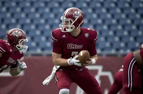 Massachusetts quarterback Blake Frohnapfel (7) warms up before an NCAA college football game against Akron in Foxborough, Mass., Saturday, Nov. 7, 2015. (AP Photo/Michael Dwyer)
