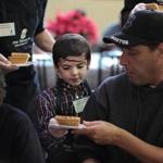 Seven year old Rocco Coletti, along with his brother David, served pie to the clients at the Pine Street Inn.  