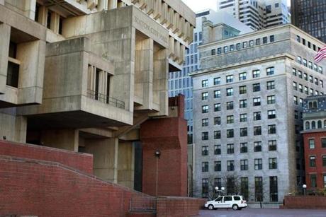 The New England Center for Homeless Veterans (right) is steps away from Boston City Hall (left).

