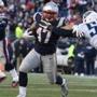 Foxborough MA 12/20/15 New England Patriots Joey Iosefa straight arms Tennessee Titans David Bass during fourth quarter action at Gillette Stadium on Sunday December 20, 2015. (Matthew J. Lee/Globe staff) Topic: Reporter: 