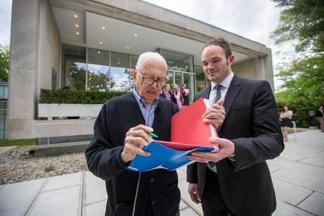 Artist Ellsworth Kelly (left) signed a book with museum director Christopher Bedford during an event at Brandeis University's Rose Art Museum.
