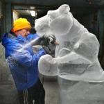 Steve Rose worked on a polar bear inside a studio freezer in Rockland. The temperature was 16 degrees and the polar bear was made from seven, 300-pound blocks of ice. It will be transported early Wednesday to Copley Square for the First Night festivities.