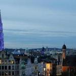 The city hall (left) on Brussels' Grand Place was illuminated during a light show on Wednesday.  