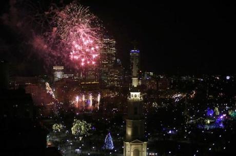 Fireworks burst over Boston Common during First Night festivities in 2014. 
