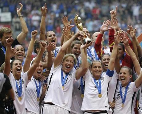 The US Women's National Team celebrates with the trophy after they beat Japan 5-2 in the FIFA Women's World Cup soccer championship in Vancouver, British Columbia, Canada, on July 5.

