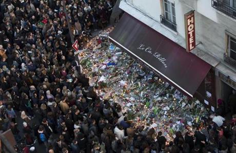 A large crowd gathers to lay flowers and candles in front of the Carillon restaurant in Paris, France, on Nov. 15. One-hundred thirty  people were killed and hundreds injured in the terror attacks which targeted the Bataclan concert hall, the Stade de France national sports stadium, and several restaurants and bars in the French capital on  Nov. 13.
