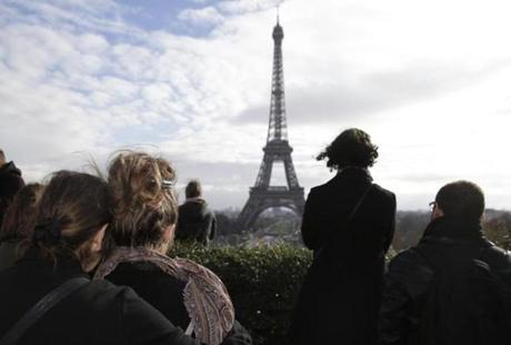 People observe a minute of silence at the Place de Trocadero in Paris on Nov. 16 to pay tribute to victims of the attacks claimed by Islamic State which killed at least 130 people and left more than 350 injured on Nov. 13. 
