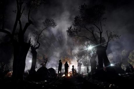 Refugees and migrants spend the night in a field outside of the Moria Hot Spot, on the Greek island of Lesbos on Nov. 9. More than 3,000 refugees and migrants have drowned among the nearly 800,000 who have reached Europe this year. However, EU states have bickered for months over a joint solution, particularly over plans to relocate a total of 160,000 asylum seekers from frontline countries to other parts of the EU bloc. 
