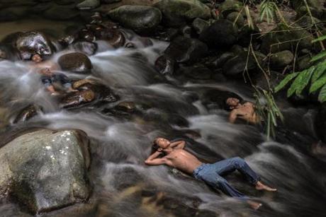Malaysian youths cool off in a river as schools remain closed due to hazy conditions in Hulu Langat on Oct. 6. Malaysia, Singapore and large expanses of Indonesia have suffered for weeks from acrid smoke billowing from fires on Indonesian plantations and peatlands that are being illegally cleared by burning. The regional environmental crisis has caused flights and major events to be cancelled, and forced tens of thousands of people in the region to seek medical treatment for respiratory problems. 
