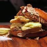 The burger is made with 8 ounce patty, shaved white truffle, Wisconsin's Rush Creek Reserve cheese, foie gras, and more on a homemade Parker House roll.